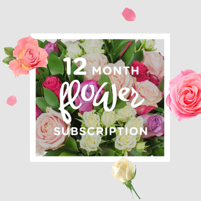 The photograph showcases a thoughtfully composed bouquet of roses that beautifully represents a 12-month flower subscription, perfect for marking life's rhythms around Stanmore. At the centre is a generous, rounded cluster of roses packed closely together, their petals interlocking to form a rich, textured surface. The colour palette moves from whisper-soft blush and creamy ivory to gentle lilac tones and deeper splashes of fuchsia, berry, and magenta, creating a harmonious blend that feels both classic and contemporary. Some roses are in full bloom, with wide, open hearts revealing countless velvety layers, while others remain partially closed, their cupped petals holding the promise of tomorrow's beauty. Lush green foliage, with a healthy sheen, frames the flowers and peeks through the gaps, giving the design structure and a touch of wildness, like the mature trees and shrubs around Canons Park or Stanmore Hill. The light is diffused and kind, casting delicate highlights across the petals and leaving soft shadows that suggest depth and roundness. Scattered around the main bouquet are loose petals and smaller blooms, seemingly suspended against a clean, creamy backdrop, evoking the delightful chaos when you unwrap a fresh delivery on a kitchen counter in Stanmore. The arrangement radiates a mood of quiet celebration and steady affection, ideal for anniversaries, new homes, or simply bringing regular beauty into everyday routines. With each imagined monthly delivery, you can picture rooms across Stanmore gently transformed by the familiar, comforting fragrance of roses and the reassuring sight of freshly arranged blooms.