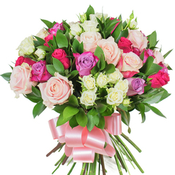 Soft morning light seems to pause on this luxuriant bouquet, revealing a rich chorus of roses in coordinated tones: pale blush-pink, creamy ivory, a punchy deep fuchsia, and notes of delicate lavender that add an unexpected, romantic lift. Large, open-headed roses form the visual anchors, while abundant miniature spray roses - mostly creamy white with subtle yellow hints - create pockets of delicate texture and depth between the larger blooms. Glossy, deep-green foliage, likely ruscus or salal, slips between stems and petals, its cool, reflective surfaces providing contrast and structure and making each rose hue feel more vivid. The stems are expertly gathered into a neat hand-tied bunch and wrapped with a wide, lustrous baby-pink satin ribbon, tied in a generous bow whose loops and tails drape softly below the blooms; the ribbon's sheen complements the roses' petals and speaks of careful finishing. The pure white background accentuates the bouquet's clean silhouette and the tactile interplay of velvety petals and sleek leaves, while the bouquet's gentle rose perfume - faintly sweet and green - seems to promise immediate freshness. As a local florist I imagine this piece being chosen by customers across Stanmore and nearby Harrow, perhaps sent to mark a birthday, anniversary, or simply to say thank you. Flower Delivery Stanmore prepares arrangements like this with neighbourhood care, aiming to bring a moment of joy and quiet elegance to doorsteps from Stanmore Hill to Stanmore Station.