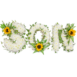 A carefully composed sympathy tribute that spells SON in three dimensional, capital letters, photographed in soft studio light on a stark white backdrop to make every texture visible. Each letter is densely formed from small, ivory-white chrysanthemums that create a pillowy, tactile surface - their delicate scent faint but consoling - while swathes of dark green ivy are artfully threaded through the formation, the trailing vines suggesting ongoing connection and resilience. Complementing the white base are lighter fern fronds and assorted leafy stems which cradle a prominent sunflower at the lower curve of the O; two more sunflowers - one on the upper-left of the S and one on the upper-right of the N - bring bright, golden warmth and visual focus. The sunflowers' broad yellow petals and deep brown centres contrast pleasantly with the pure white blooms and the varied greens, offering a hopeful accent within a solemn composition. As a local Stanmore florist, Flower Delivery Stanmore arranges pieces like this for funerals and memorials across Stanmore, from Canons Park to Stanmore High Street, where families appreciate the balance of classic bereavement whites with a touch of cheerful colour. The arrangement's layered textures, careful vine placement and thoughtful sunflower accents read as both a respectful goodbye and a quiet celebration of life, an image that communicates tenderness, memory and a steady, comforting presence.