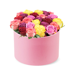 This round, pastel pink hat box is soft to the touch and finished with a velvety sheen, sitting against a clean white backdrop and inviting you to study its generous bouquet. From the top spill dozens of freshly bloomed roses, forming a curved dome that feels as if it could topple with fragrance alone. The palette moves from deep crimson to magenta, then to bright sunny yellow, pale bubblegum pink, and bi-color blossoms that transition from pink to cream. The blooms are tightly packed, so the box reads as a lush jewel of color, with only sparse green leaves peeking through. It is the kind of gift that signals celebration, romance, or heartfelt thanks, and it would be equally at home in a feature about premium flower delivery, special occasion bouquets, or Mothers Day surprises.

Across Stanmore, this modern, luxurious arrangement is the handiwork of a local florist who understands timing and presentation. It is ideal for same-day delivery to Stanmore's streets and to nearby NW London destinations, arriving in pristine condition for birthdays, anniversaries, or romantic moments. The soft pink exterior frames a dazzling interior of crimson, magenta, yellow, pink, and cream-toned roses, with the box acting as an elegant centerpiece. The overall effect communicates sophistication and giver's thoughtful care, a perfect centerpiece for a mantel or dining table. For readers shopping for reliable premium gifting, this image underscores the craft and care that a local Stanmore florist brings to every creation, and it nods to the comfort of receiving a truly luxurious bouquet at home.
