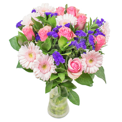 Arranging this bouquet in Stanmore, I'm always touched by the delicate interplay between blush-toned gerberas and timeless pink roses, their soft pastels pooling together like a watercolour dawn. Accents of deep purple statice thread through the composition, punctuating the blooms much like the picturesque details one discovers along Stanmore Hill or near the station. There's a crispness in the dewy leaves-fresh, cool, and grounding-cradling the airy sweetness above. Displayed in an understated glass vase, the bouquet seems to glow with quiet inner light, just as the morning sunshine filters into Stanmore's family kitchens and living rooms. Suitable for gifting warmth to a friend recovering at home or for adding a graceful touch to a birthday celebration, this arrangement embodies the attention to detail and joy that defines Flower Delivery Stanmore's approach. It's crafted with care to bring a touch of local freshness and elegance to any occasion.