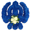 A carefully crafted Sikh Khanda floral arrangement is centred in the frame, resting on a pristine white background that highlights the elegance of its form. The Khanda - with its upright sword, surrounding chakkar, and two curved kirpans - is completely covered in a dense layer of royal blue chrysanthemums or similar tightly clustered blossoms. Each small flower head is placed close to the next, creating a continuous, velvety blanket of vivid blue, like a deeply coloured tapestry rendered in petals rather than thread. The tone of blue is rich and dignified, suitable for solemn occasions and reminiscent of the calm evening skies over Stanmore's residential streets and nearby open spaces. Just below the midpoint of the central sword, three white roses form a delicate, eye-catching feature. Their petals are softly layered and partially open, giving a sense of life and tenderness amid the strong lines of the emblem. These roses are surrounded by wisps of baby's breath and a collar of dark green foliage, which introduces a gentle contrast of colour and texture, symbolising peace, purity, and enduring love. Soft, even light falls across the tribute, revealing the depth of the flowers and casting the faintest shadows beneath the edges, which makes the arrangement appear slightly raised from the surface. The overall impression is of a thoughtful and respectful funeral or memorial tribute, the kind of floral Khanda that might be delivered across Stanmore and neighbouring areas for services, cremations, or home gatherings, offering a comforting and culturally appropriate way to honour Sikh faith and remember a cherished life.