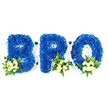 An eye-level studio photograph set against a pure white background shows a three-piece sympathy tribute spelling BRO in large, freestanding capital letters. Each letter - B, R and O - is lovingly covered in a dense blanket of royal blue chrysanthemum florets, the petals packed tightly to form plush, textured surfaces with crisp, well-defined edges. A thin white base or foam frame remains visible around the loops and negative spaces, particularly inside the B and O, hinting at the careful construction beneath the flowers. At the lower left curve of the B and the lower right bases of the R and O sit small, elegant accent clusters: creamy ivory spray roses in various stages of bloom, tiny white filler blooms (suggestive of miniature chrysanthemums or baby's breath) and mixed greenery. The foliage ranges from broader glossy leaves that resemble salal or lemon leaf to feathery, fern-like fronds that add movement and soft contrast. Under neutral, even studio lighting the blue reads deep and saturated - a colour that quietly conveys peace and remembrance - while the pale roses and white accents breathe warmth and serenity into the composition. The arrangement carries a gentle scent of roses and green foliage when close, and its compact, tactile surfaces invite a quiet, reverent gaze. As a custom memorial piece this BRO tribute reads as a personal, dignified expression of loss and kinship, appropriate for a funeral or wake. For local families in the Stanmore area who have bookmarked Bentley Priory or taken reflective walks on Stanmore Common, this arrangement communicates a calm, respectful farewell designed to honour a brother's memory.