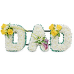 A dignified, three-dimensional memorial piece spelling the word DAD in large uppercase letters, each letter formed from a dense carpet of pristine white spray chrysanthemums that give the surface a soft, cloud-like texture. The letters sit against a plain white backdrop under gentle, even light that emphasizes the clean white blooms and the delicate shadows between petals. Each letter's outer and inner edges are crisply outlined with a ruffled, deep green satin ribbon that reads like a tailored frame, and a set of slim dark-green metal support bars runs horizontally behind the trio to keep the composition sturdy and unified. The left-hand D is accented at its upper left curve with a cheerful cluster of 3-4 sunlit yellow roses, small white filler blooms-likely freesias or gypsophila-and fresh green foliage; two long, bare green stems arch from that cluster and reach inward toward the centre A, adding a sense of movement. The central A carries a more contemplative accent on its lower left diagonal: two elegant, deep purple-to-burgundy calla lilies with trumpet-shaped blooms nestle among tiny white accents and glossy leaves, offering a quiet focal point. The right-hand D mirrors the left, bearing the same radiant yellow rose cluster on its upper right curve. The overall effect is both personal and restrained-white for peace, yellow for fond remembrance, and purple for reverence-crafted as a bespoke sympathy tribute suitable for funeral services around Stanmore, from ceremonies near Stanmore High Street to remembrances at Canons Park. The piece suggests a soft, clean scent and a careful, hand-forged finish by an experienced florist attentive to texture, colour, and respectful presentation.