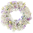 A softly elegant floral wreath is centred against a stark white background, its circular shape perfectly balanced and filled to the edges with delicate blossoms. The primary impression is of a white, airy ring made from dense clusters of Baby's Breath, each tiny flower blending into the next to create a continuous, cloud-like surface. Rising from this feathery base are clusters of Lisianthus, their petals unfolding in gentle ruffles. These Lisianthus blooms are mostly white, with each petal subtly accented by edges and fine veins of lavender, lilac, and cool violet, giving the design a refined touch of colour. Some flowers are fully open and generous, while others remain partially closed, with slender buds shaded in pale green and cream hinting at more blooms to follow. There is no visible greenery or ribbon, keeping the composition clean, restrained, and focused on the interplay of texture and tone. The inner circle of the wreath is left open, reinforcing the traditional symbolism of continuity and eternity often associated with funeral and memorial tributes. The lighting is soft and even, enhancing the pristine whites while allowing the purples to remain understated and soothing. This wreath would make a thoughtful sympathy gesture in Stanmore, whether delivered to a family home, placed in a quiet chapel, or laid at a graveside. Its gentle combination of Baby's Breath and Lisianthus expresses condolence and respect with subtlety, reflecting a sense of calm, dignified remembrance within the local community.