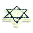 This image presents a beautifully balanced Star of David funeral arrangement, shown against a plain white background that emphasises its clean lines and rich symbolism. The entire six-pointed star is composed of densely arranged chrysanthemums, their small, layered petals forming a plush, almost fabric-like texture. Along the outer edge, a generous band of white flowers traces each point and angle of the Magen David, creating a bright frame that leads the eye inward. That same pure white continues into the central hexagon and six inward-reaching triangles, giving the heart of the tribute a serene, almost glowing quality. Surrounding these calm, pale sections, the two interlocking triangles that complete the classic Jewish symbol are densely packed with navy blue blossoms. The dark blue petals stand in strong contrast to the white, shaping bold diagonal lines and giving the star its distinct, interlaced appearance. The symmetry is precise, suggesting the careful hands of an experienced florist working steadily in a Stanmore workshop early in the day. While the background gives no direct clue to setting, one can easily picture this piece resting beside a casket in a local synagogue or being placed delicately at a graveside in or around Stanmore. The blue-and-white palette naturally recalls Jewish identity and the Israeli flag without overwhelming the eye, making the tribute both personal and communal in meaning. It feels like a gentle yet formal gesture of farewell, ideal for a Jewish funeral or remembrance ceremony where family and friends wish to honour a loved one with a symbol of faith, continuity, and shared history.