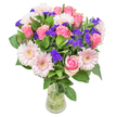 There's a gentle, lyrical beauty to this arrangement from Stanmore-each soft pink rose unfurling delicately, set amongst the broad, sunlit petals of pale gerbera daisies and anchored by a lush cascade of deep green leaves. The roses' silken blush suggests affectionate nostalgia or quiet gratitude, making the bouquet perfect for milestone birthdays or warm congratulations. Pops of vivid purple statice, papery and aromatic, are tucked playfully throughout, giving the display an invigorating spontaneity so familiar to Stanmore's spirited community gatherings. The whole bouquet feels fresh yet airy, much like a spring stroll past Bernays Gardens under a clear sky-both tranquil and inviting. Every flower is thoughtfully chosen and arranged, ensuring that the recipient in Stanmore feels treasured and uplifted with every delivery-a true expression of care from a local florist who understands the area's spirit.